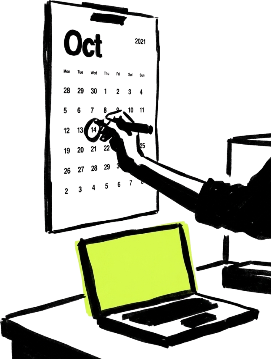 Mano señalando un calendario junto a una laptop